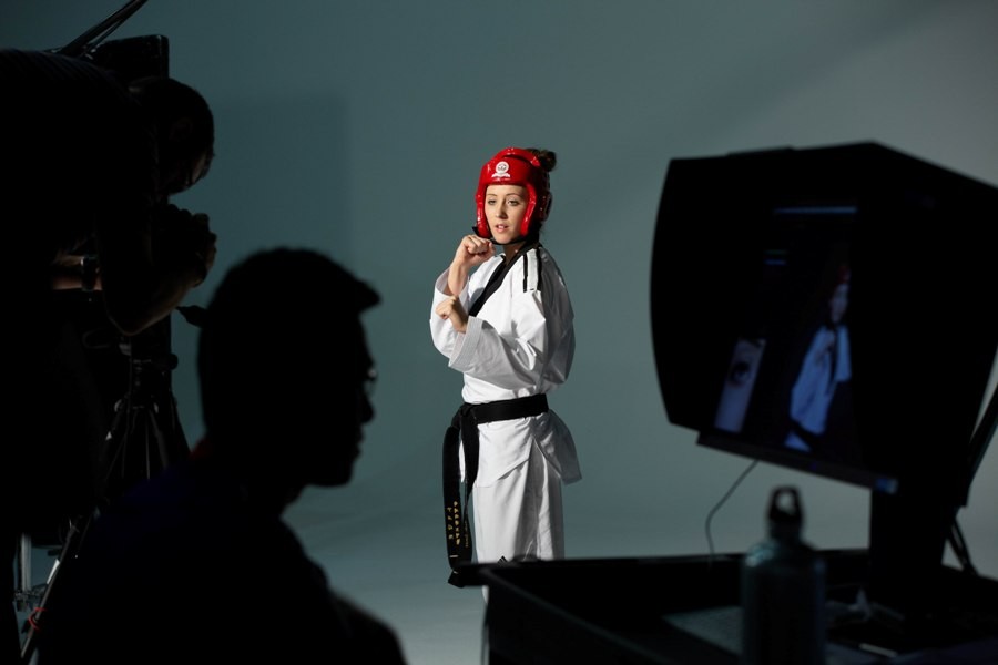 Jade Jones kicking, in a red head-guard, on set