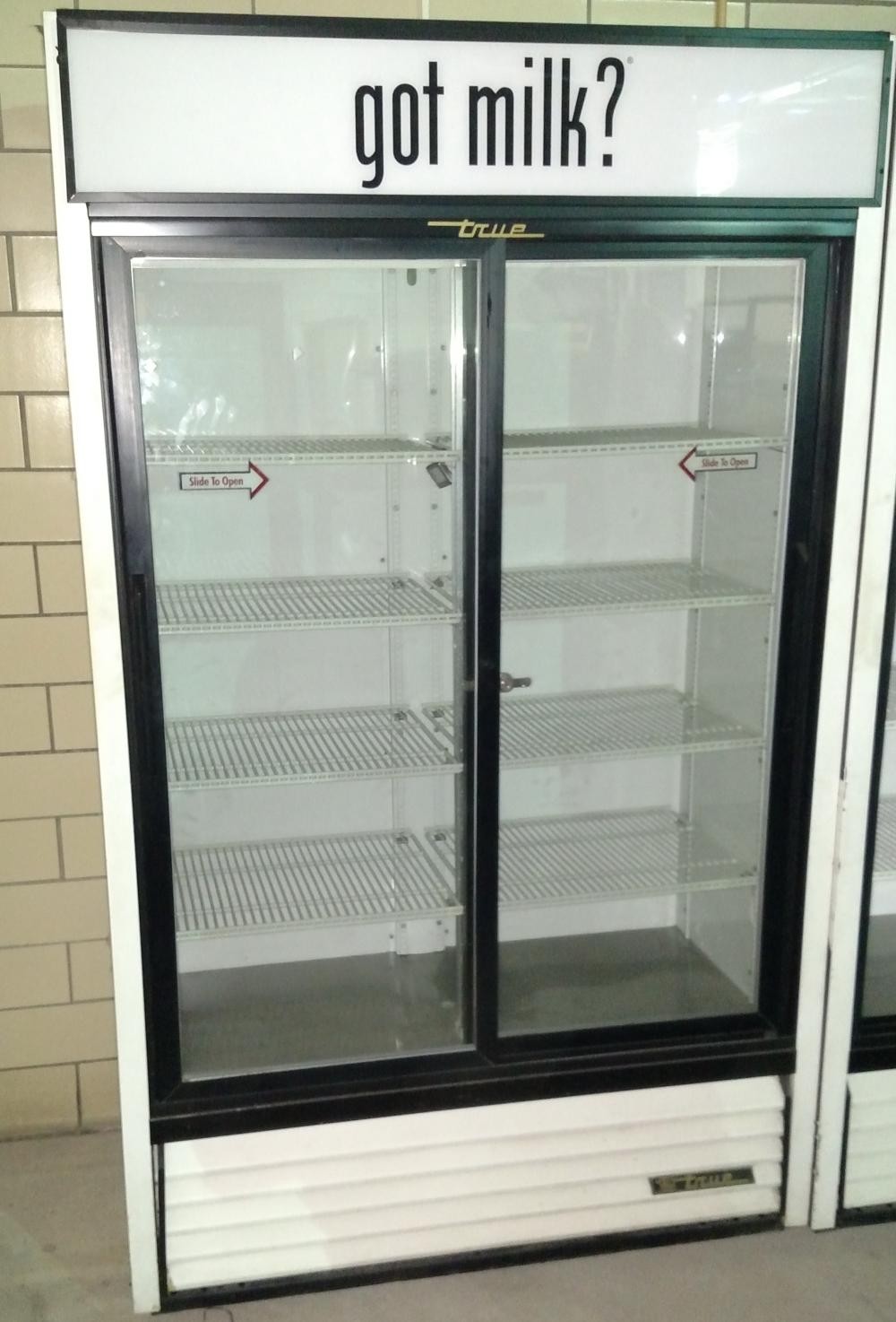 True glass-door store cooler with got milk? header