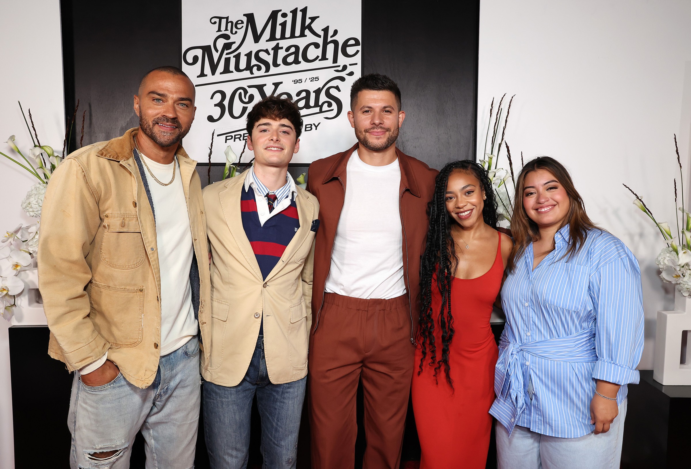 Launch guests under “The Milk Mustache 30 Years” sign, September 9, 2025