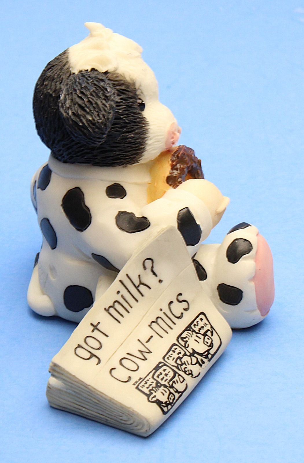 Side view, with the “got milk? cow-mics” newspaper